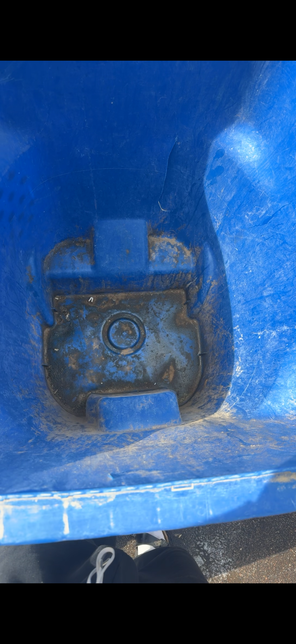 Dirty blue trash can — before